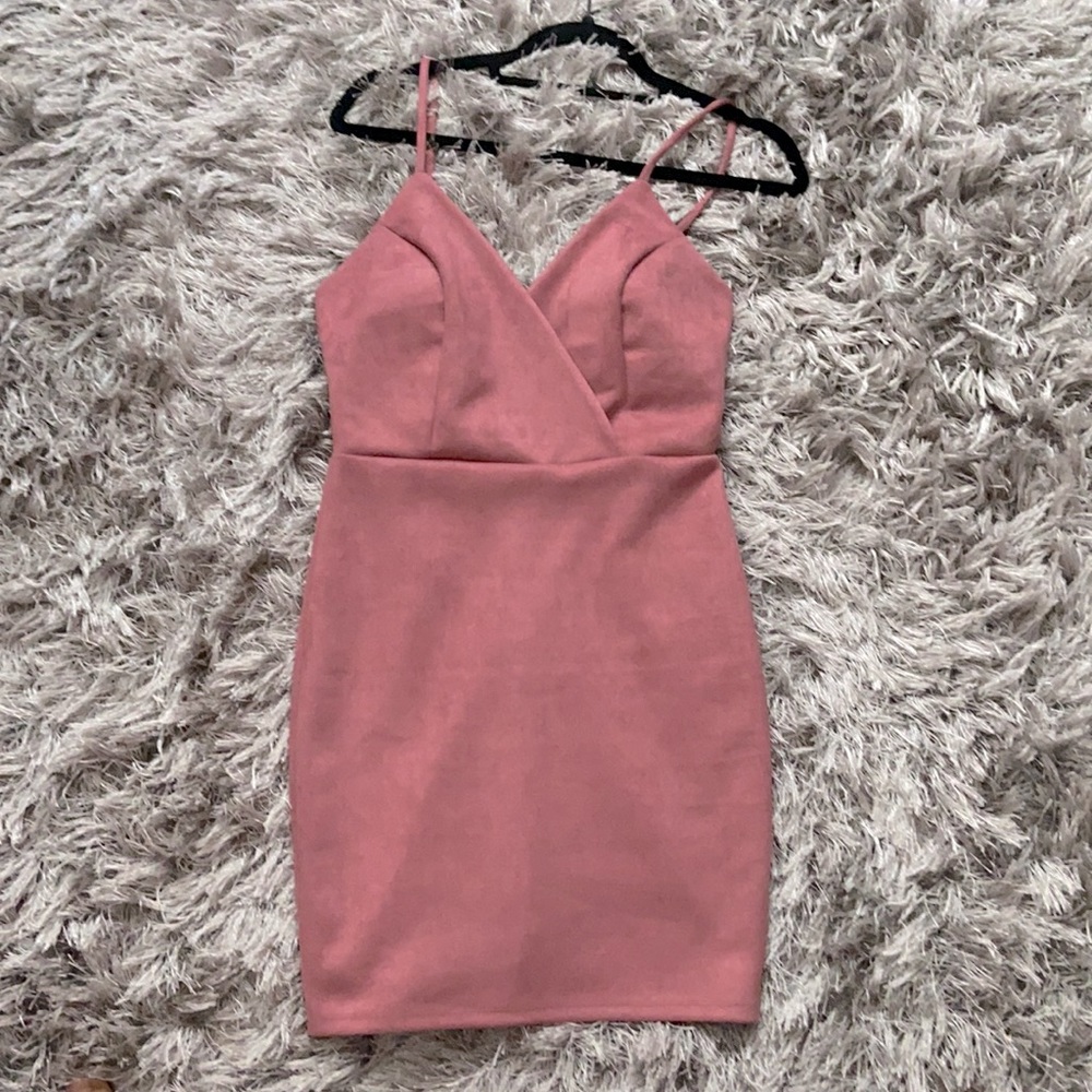 Boutique tag still on. Nice rose or emerald green colored dresses.